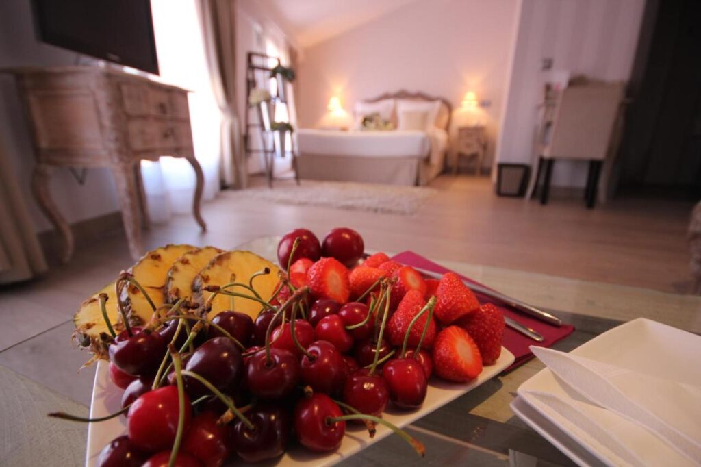 a plate of fruit in a hotel room at le petit boutique hotel in santander spain