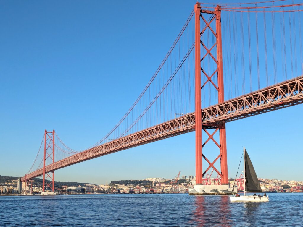 view of the 25th of april bridge from the lisbon sunset cruise