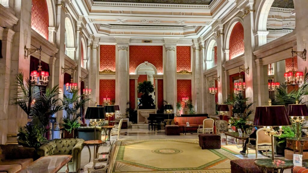 the elegant lobby area of the avenida palace hotel in lisbon