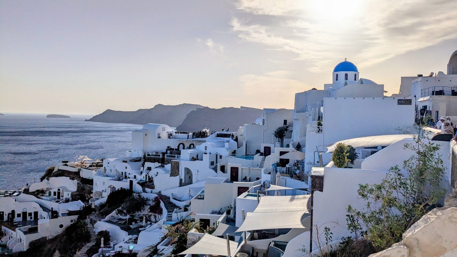 the caldera on santorini with blue domed church