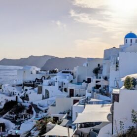 the caldera on santorini with blue domed church