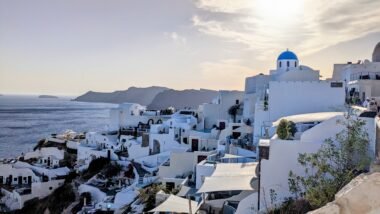 the caldera on santorini with blue domed church