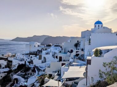 the caldera on santorini with blue domed church