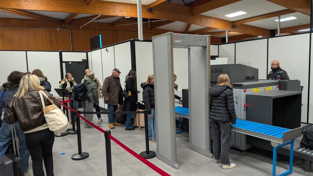 people lining up in a queue before security checks at caen ferry port