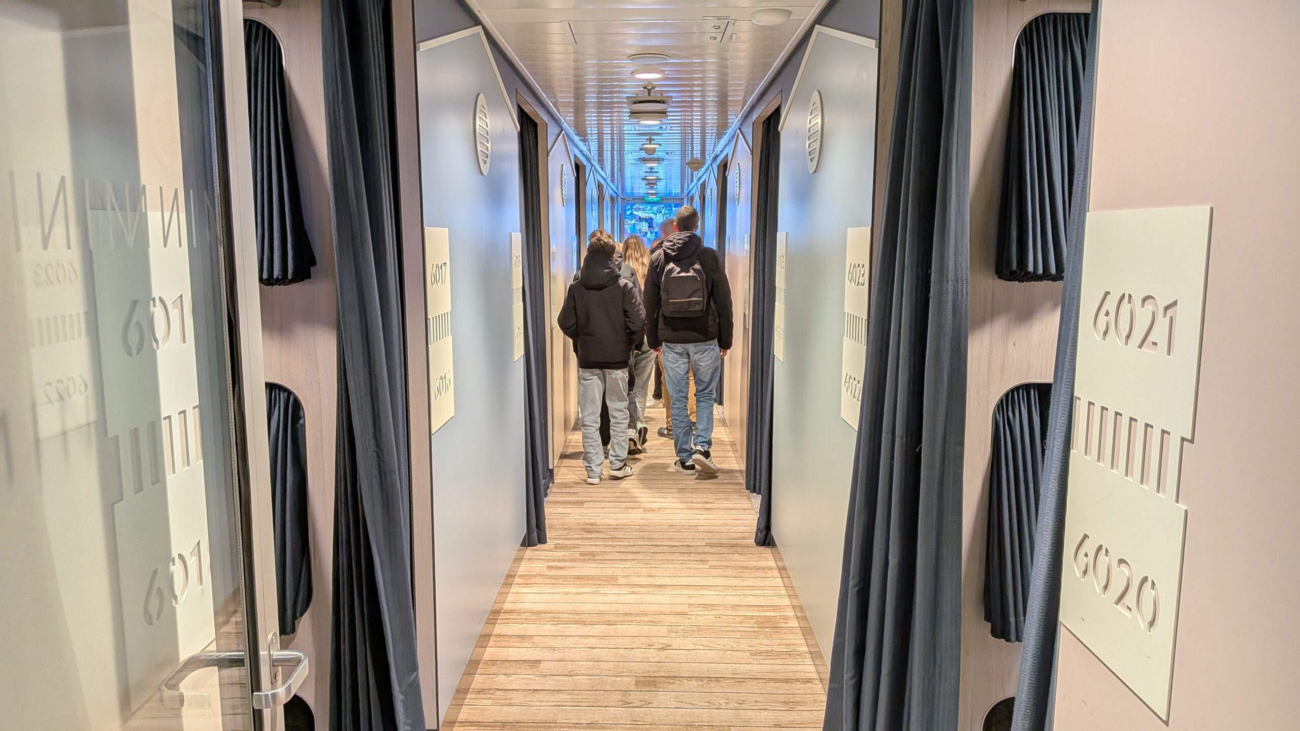The passageway leading to each cabin on either side in Couchette Plus